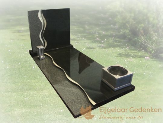 Grafmonument met sierlijk golfje