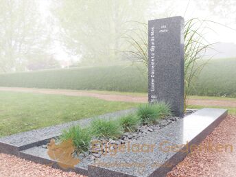 Modern grafmonument met siergrassen