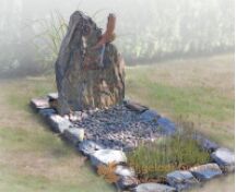 Natuurlijke grafsteen met vogel cortenstaal foto 1